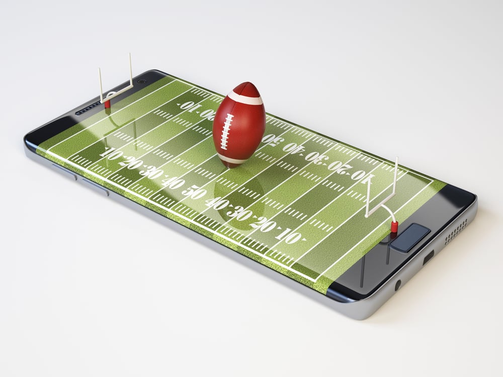 mobile sports betting concept shows American football and pitch images on smartphone screen